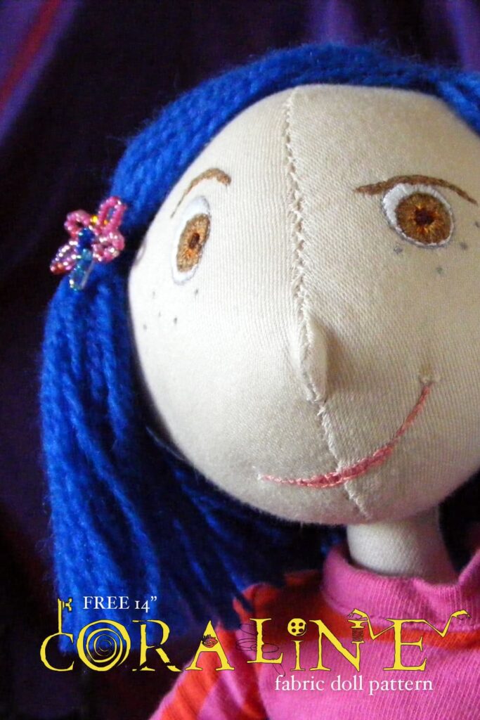 Pinterest pin for the Coraline doll, with a close up image of her cheeky face. I am quite pleased with the layout of this pin!