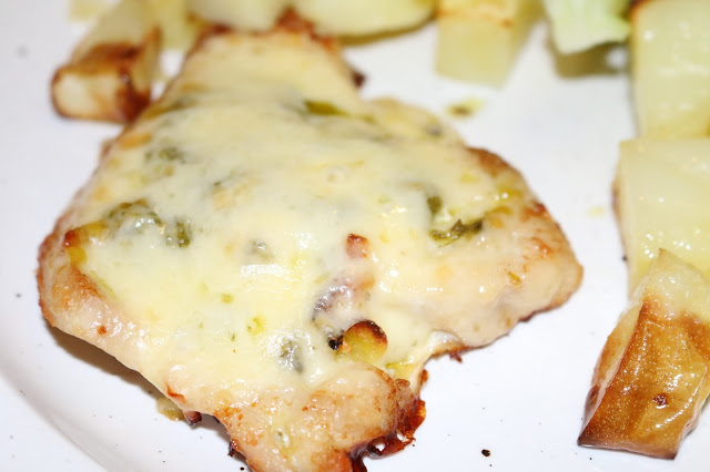 Baked turkey steaks with pesto and cheese