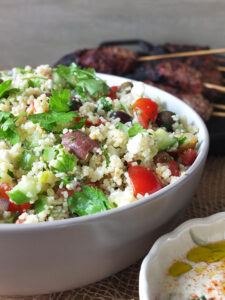 Close up image of mediterranean couscous salad.