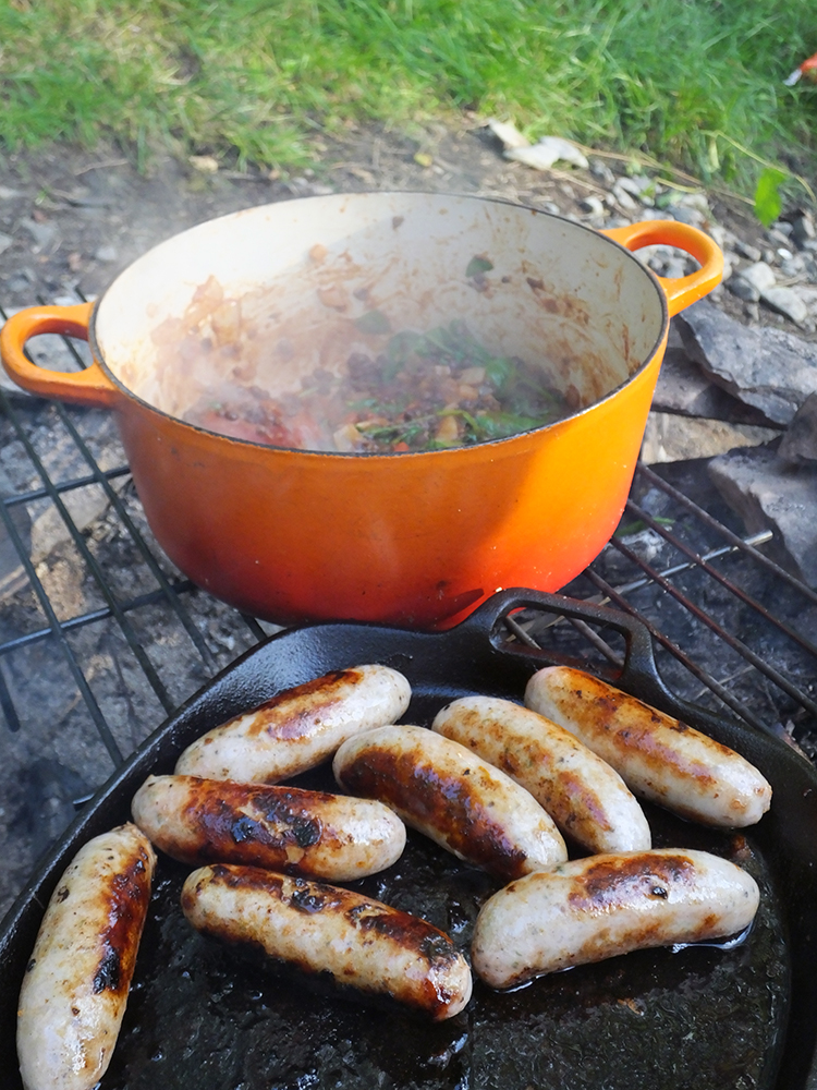 Cooking Sausages over a campfire