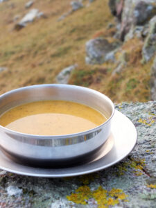 Curried Butternut Squash Soup - A delicious blend of warming spices and creamy butternut squash. A perfect soup to pour into a flask and take on a winter hill walk.