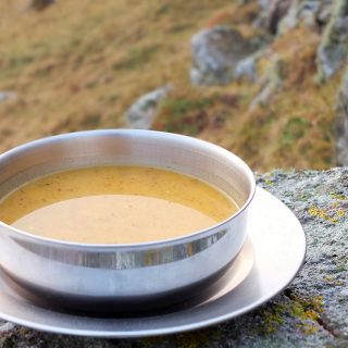 Curried Butternut Squash Soup - A delicious blend of warming spices and creamy butternut squash. A perfect soup to pour into a flask and take on a winter hill walk.
