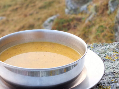 Curried Butternut Squash Soup - A delicious blend of warming spices and creamy butternut squash. A perfect soup to pour into a flask and take on a winter hill walk.