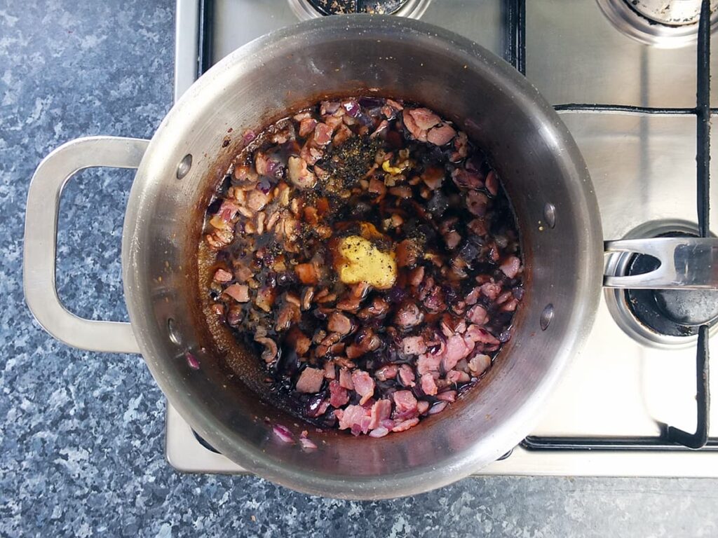 Image of bacon jam ingredients in pan.