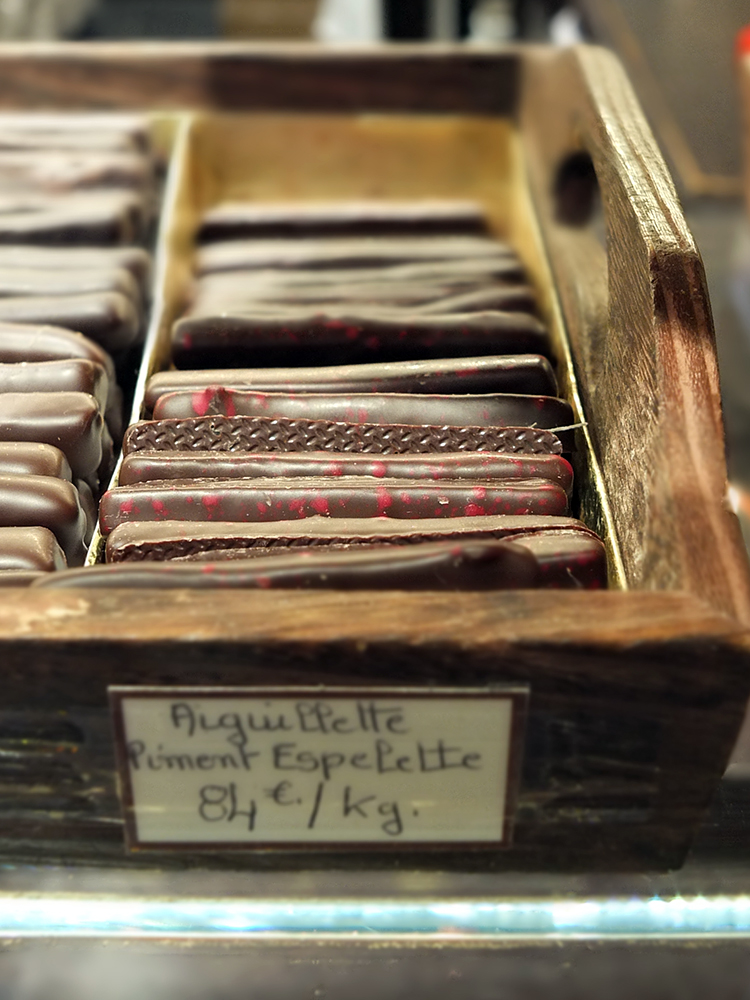 Image of a wooden box filled with chocolate fingers in Paris.