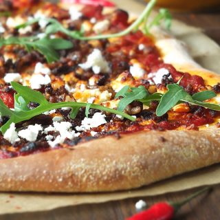 Spicy Lamb Pizza with Feta, Rocket and a Yogurt Drizzle