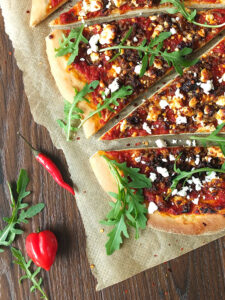 Spicy Lamb Pizza with Feta, Rocket and a Yogurt Drizzle