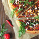 Spicy Lamb Pizza with Feta, Rocket and a Yogurt Drizzle