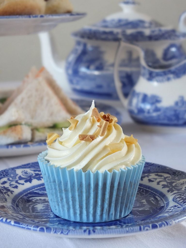 Raspberry Filled Vanilla Cupcakes with White Chocolate Frosting