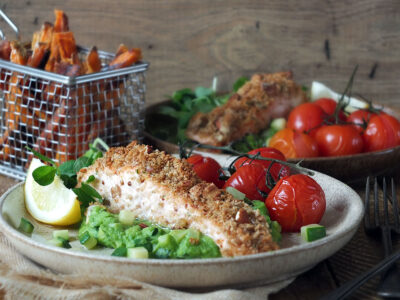 Baked nut-crusted salmon with pea puree & crispy sweet potato fries