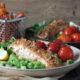 Baked nut-crusted salmon with pea puree & crispy sweet potato fries