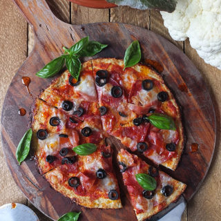 This low carb, high protein, gluten free cauliflower pizza crust has only 220 calories for a whole pizza!
