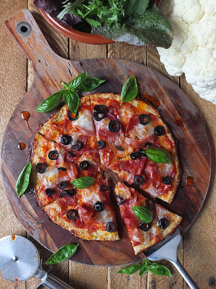 This low carb, high protein, gluten free cauliflower pizza crust has only 220 calories for a whole pizza!