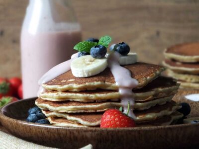 Oatmeal pancakes with a strawberry yogurt-maple syrup drizzle
