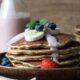 Oatmeal pancakes with a strawberry yogurt-maple syrup drizzle