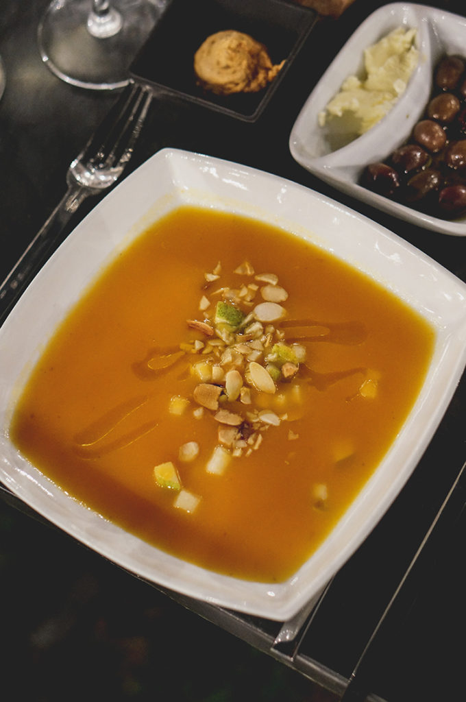 Cream of carrot soup with pear and toasted almonds