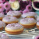 In this easy recipe, lemon zest, lemon extract and lavender flowers are combined to make a delicious, fluffy, moist, perfectly baked doughnut with a lavender icing sugar glaze. #doughnuts #bakeddoughnuts #lavender #lemondoughnut #lemondonut #bakeddonut