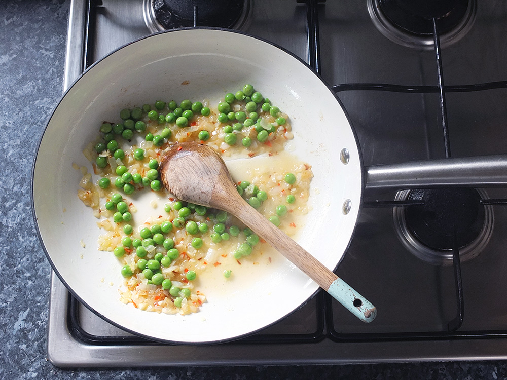 cooking peas on a gas stove