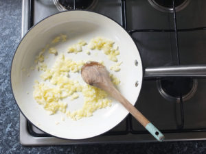 sauteing onions on a gas stove