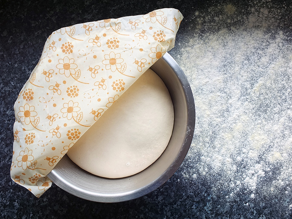 Beeswax cotton wrap covering rising bread dough