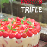 Perfect for summer, this strawberry Prosecco trifle recipe features strawberry jelly, Prosecco-soaked strawberries, homemade Madeira sponge cake, custard and sweetened whipped cream. #prosecco #trifle #strawberryrecipe #elizabethskitchendiary