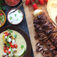 This triple lamb fajitas recipe for a crowd is perfect if you're entertaining guests. Part Mexican fajita, part Middle Eastern kebab and part over the top extravagant, this recipe can be ready in just two hours! #fajita #lamb #kebab