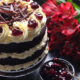 Layers of rich chocolate cake drizzled with cherry brandy sandwiched together with sweetened whipped cream and black cherry conserve. The cake is finished with more cream and some dark chocolate curls.