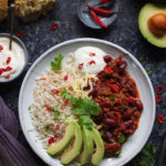 This super easy Chilli con Carne recipe is made with lamb mince, which lends a delicious earthy flavour to the classic dish. Serve with rice, soured cream and slices of creamy avocado - perfect for a midweek meal.