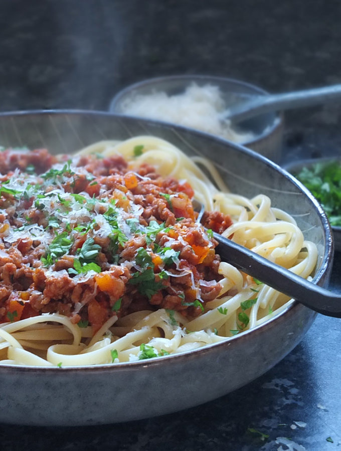 Lamb bolognese with linguine and Parmesan on top