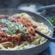 Lamb bolognese with linguine and Parmesan on top