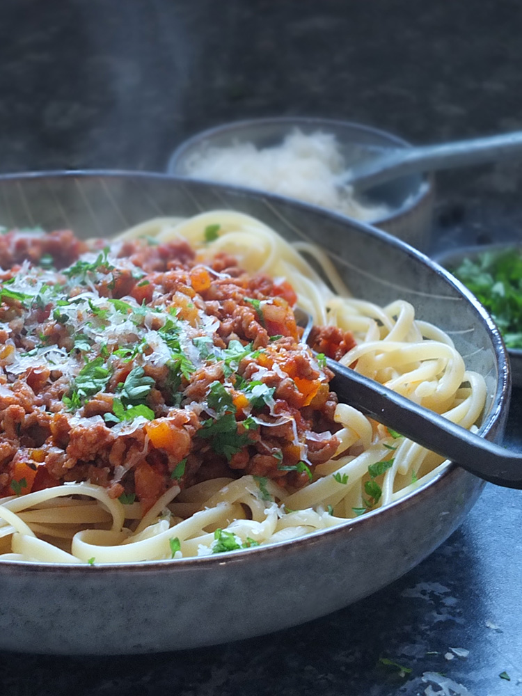 Lamb bolognese with linguine and Parmesan on top