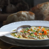 Chicken noodle soup with spoon image