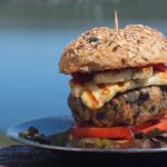 image of grilled lamb burger in bun with fiery chilli halloumi