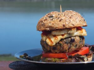 image of grilled lamb burger in bun with fiery chilli halloumi