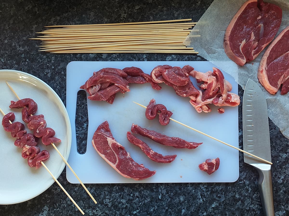 lamb leg steak strips on bamboo skewers image 