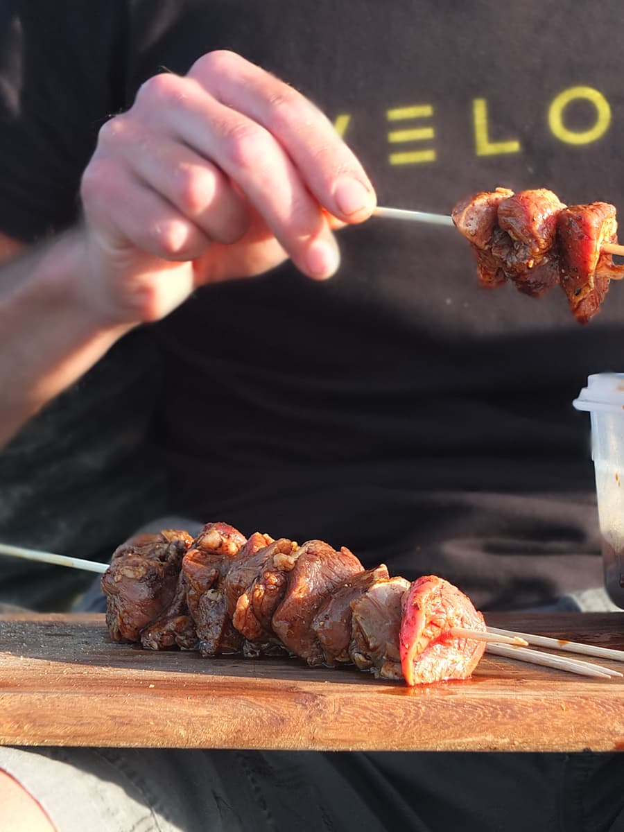 BBQ lamb shoulder on skewers image