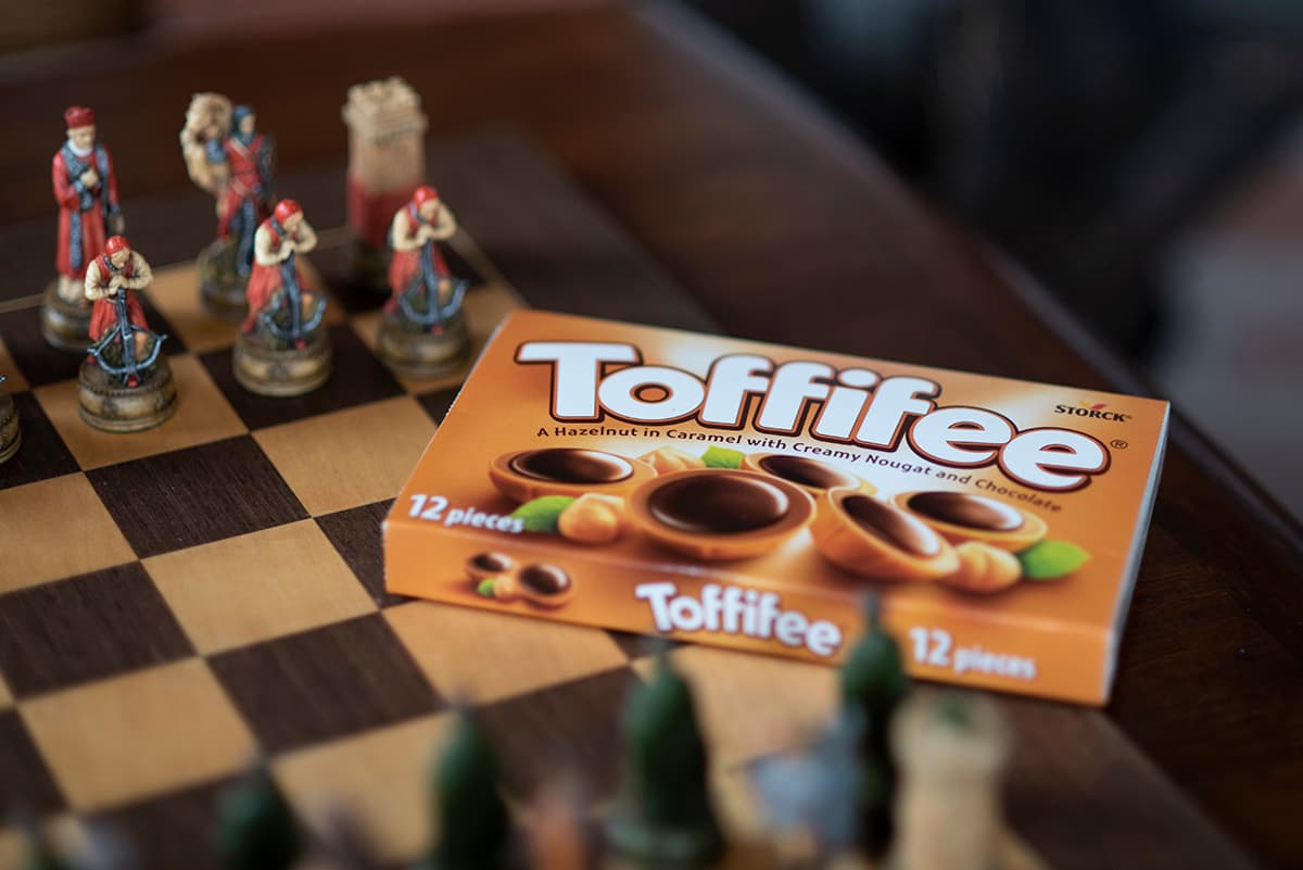 Photograph of Toffifee unopened package on a chess board