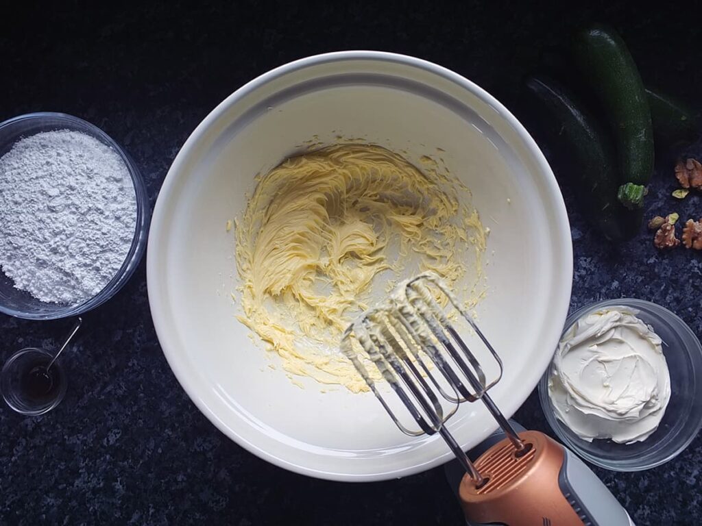 Image of room temperature butter beaten until smooth in a bowl.