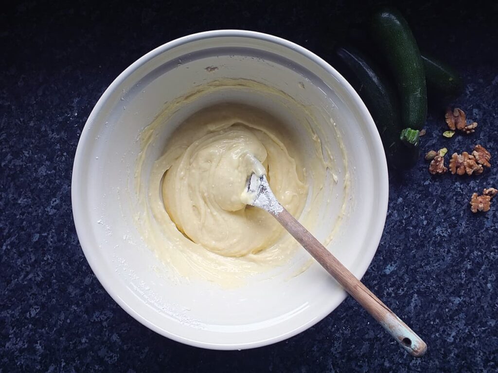 Photo of cream cheese frosting in a large mixing bowl.