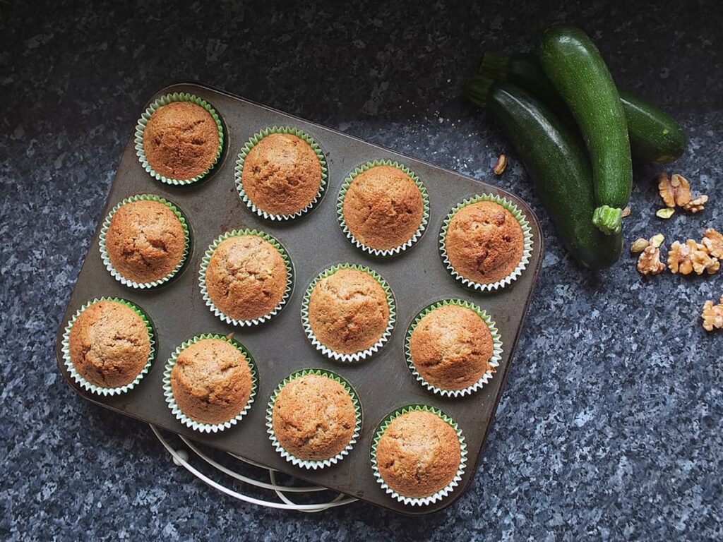 Photo of freshly baked cupcakes golden brown and springy to touch on top.