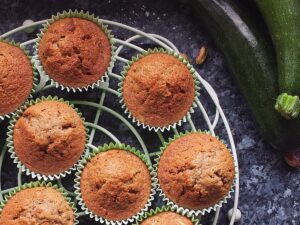 Image of cupcakes cooling on a white wire cooling rack. It's pretty, honest.