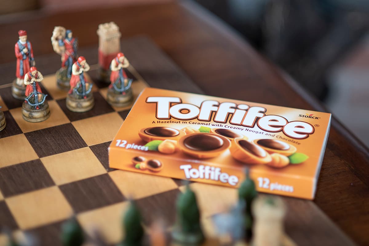 Photograph of Toffifee unopened package on a chess board