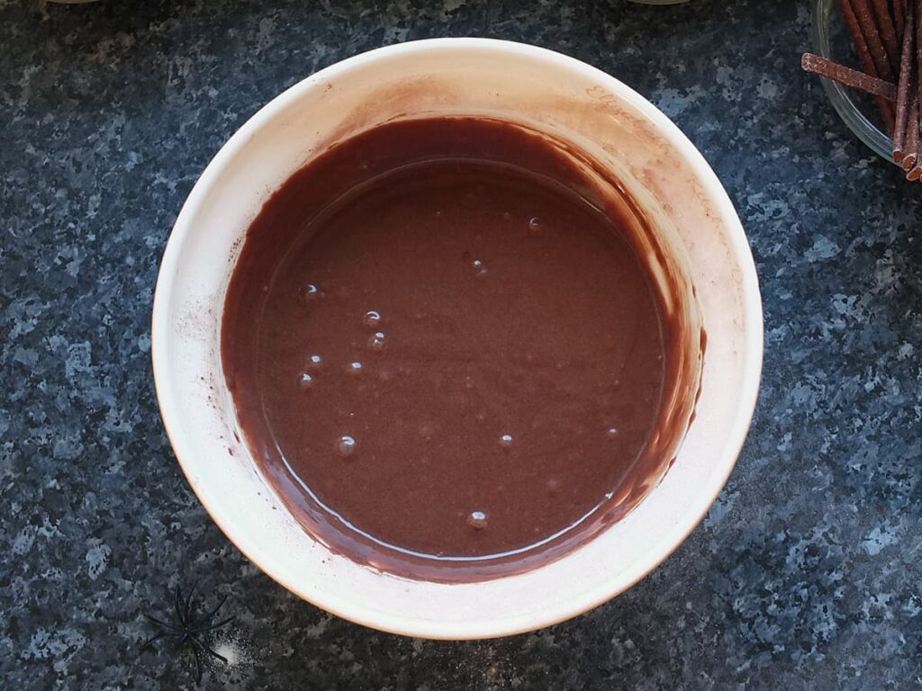 Image of step five - mixing the cake batter in a bowl.