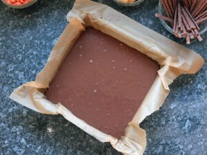 Image of cake batter in a 9-inch baking tin.