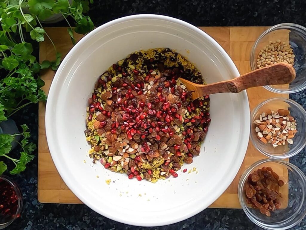Image of unmixed ingredients for jewelled couscous in a bowl.