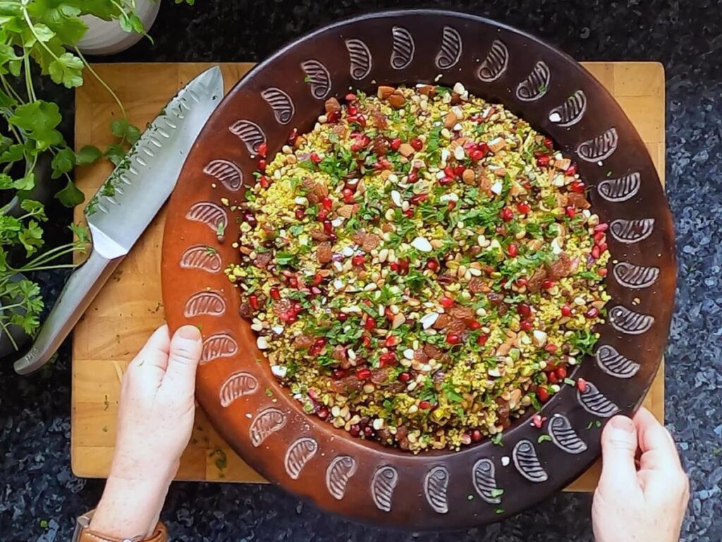 Image of jewelled couscous on a serving platter.