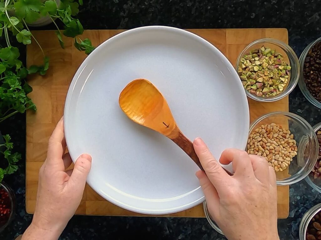 Image of plate covering a bowl of couscous.