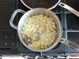 Image of celeriac cooking in pot.