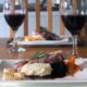 Image of a square white dinner plate with lamb leg steaks, celeriac puree and red wine jus for a romantic meal in.