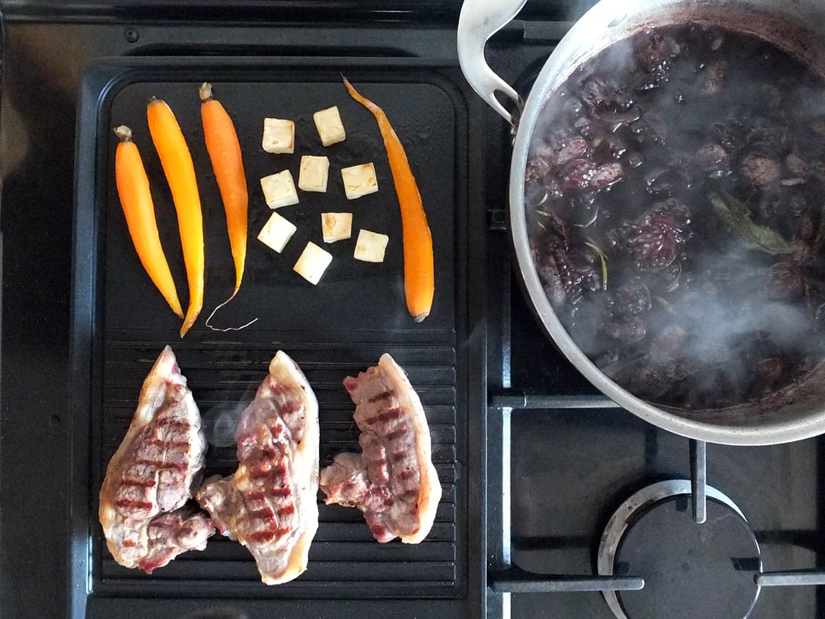 Image of lamb rump steaks being cooked on a Rangemaster griddle pan. 